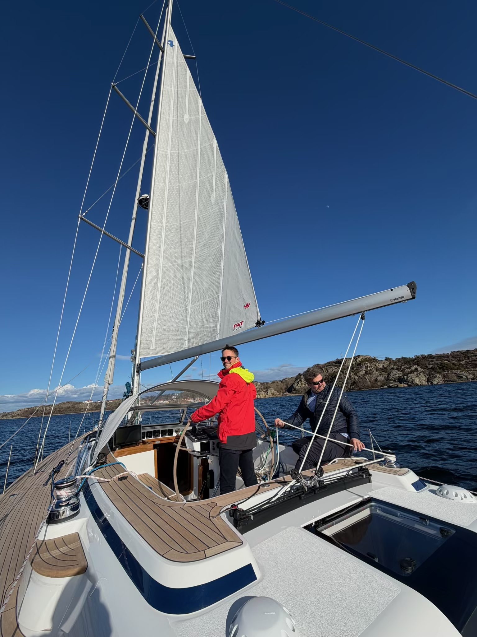 At the helm during the Code Zero sail