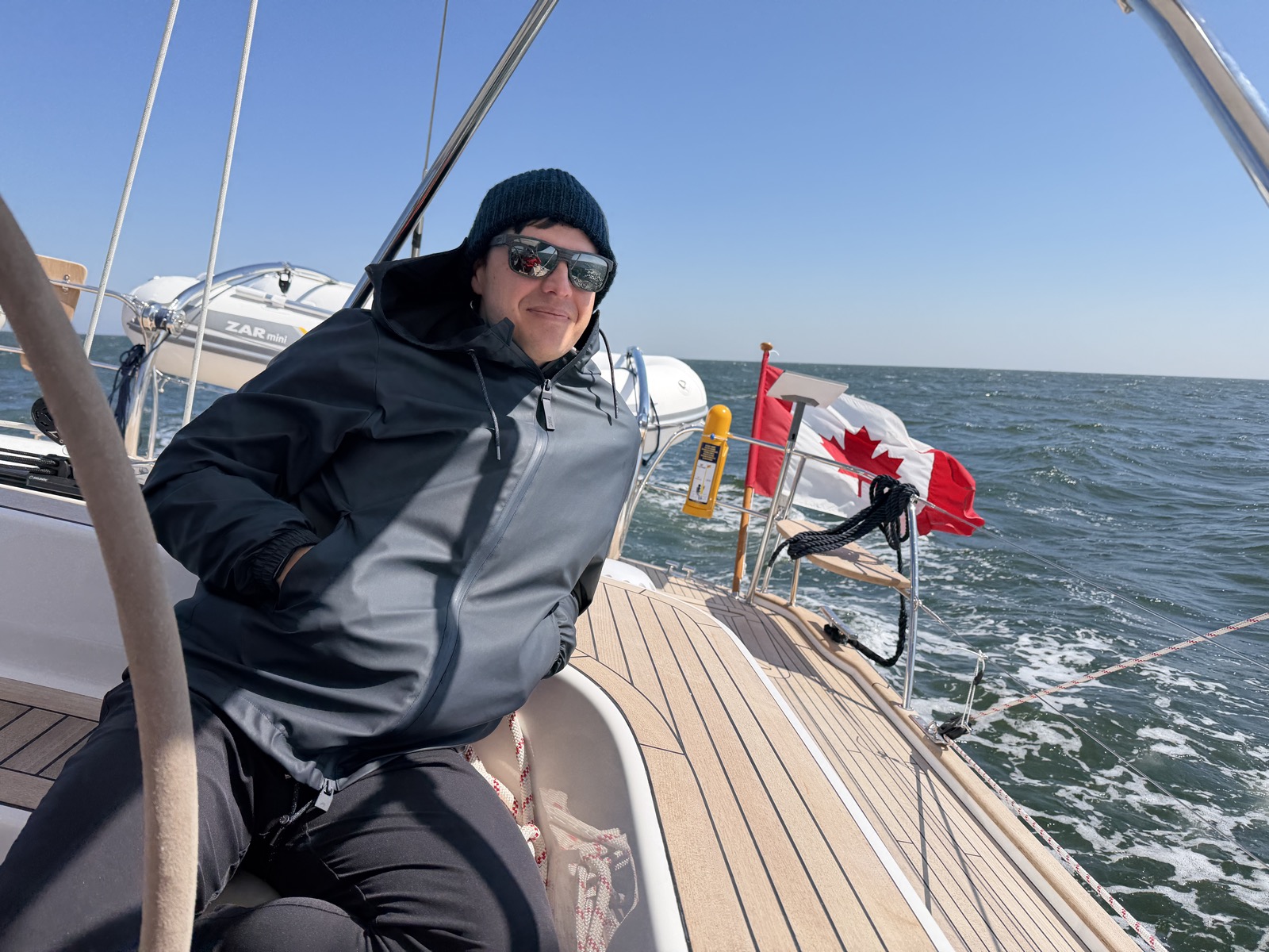 Marc on deck with Canadian flag flying