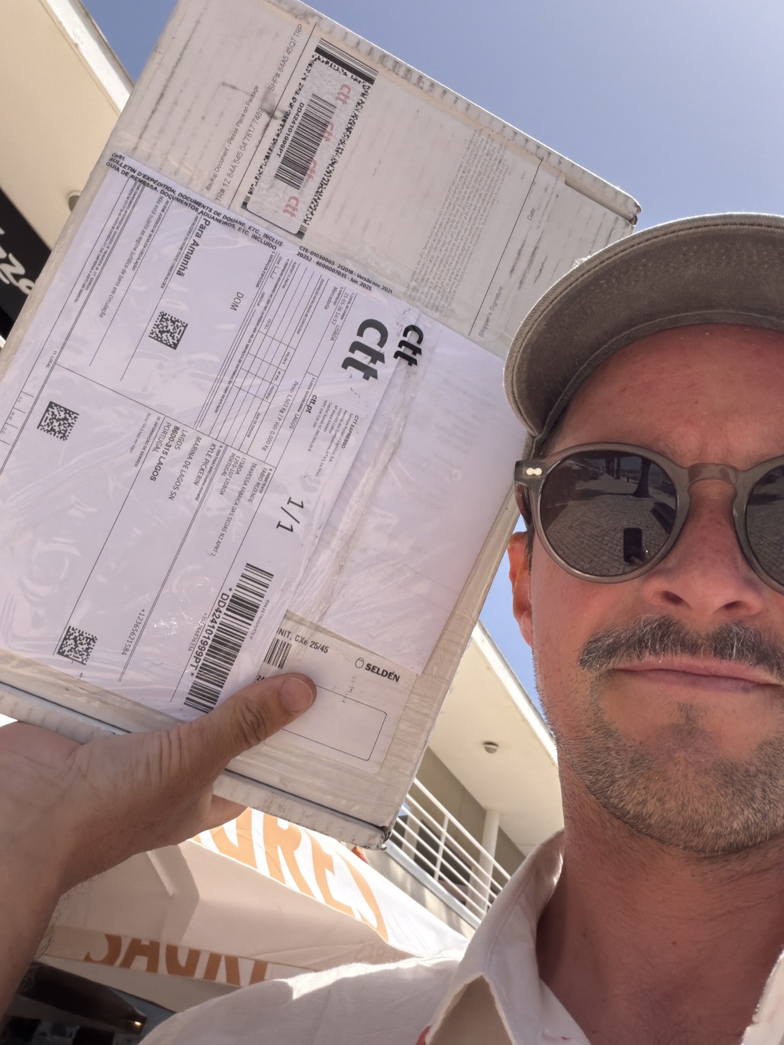 Kyle holding the overnighted Selden package