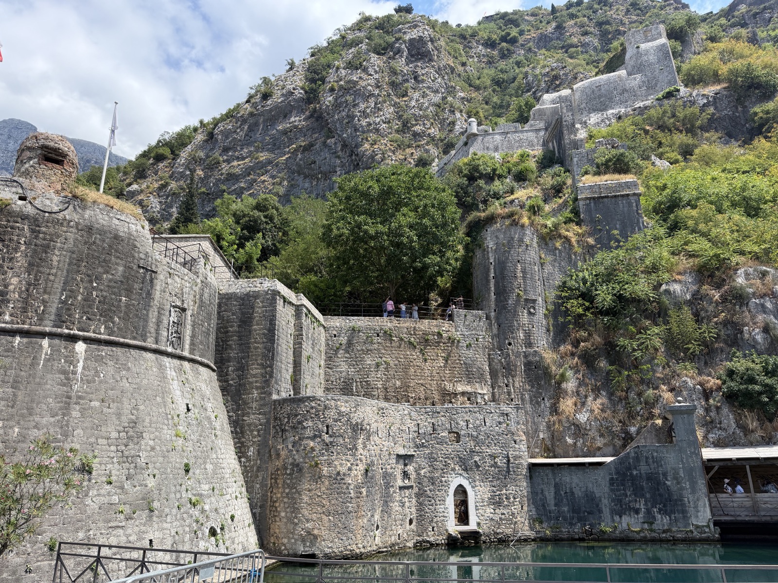 Kotor's fortress walls rising above the water