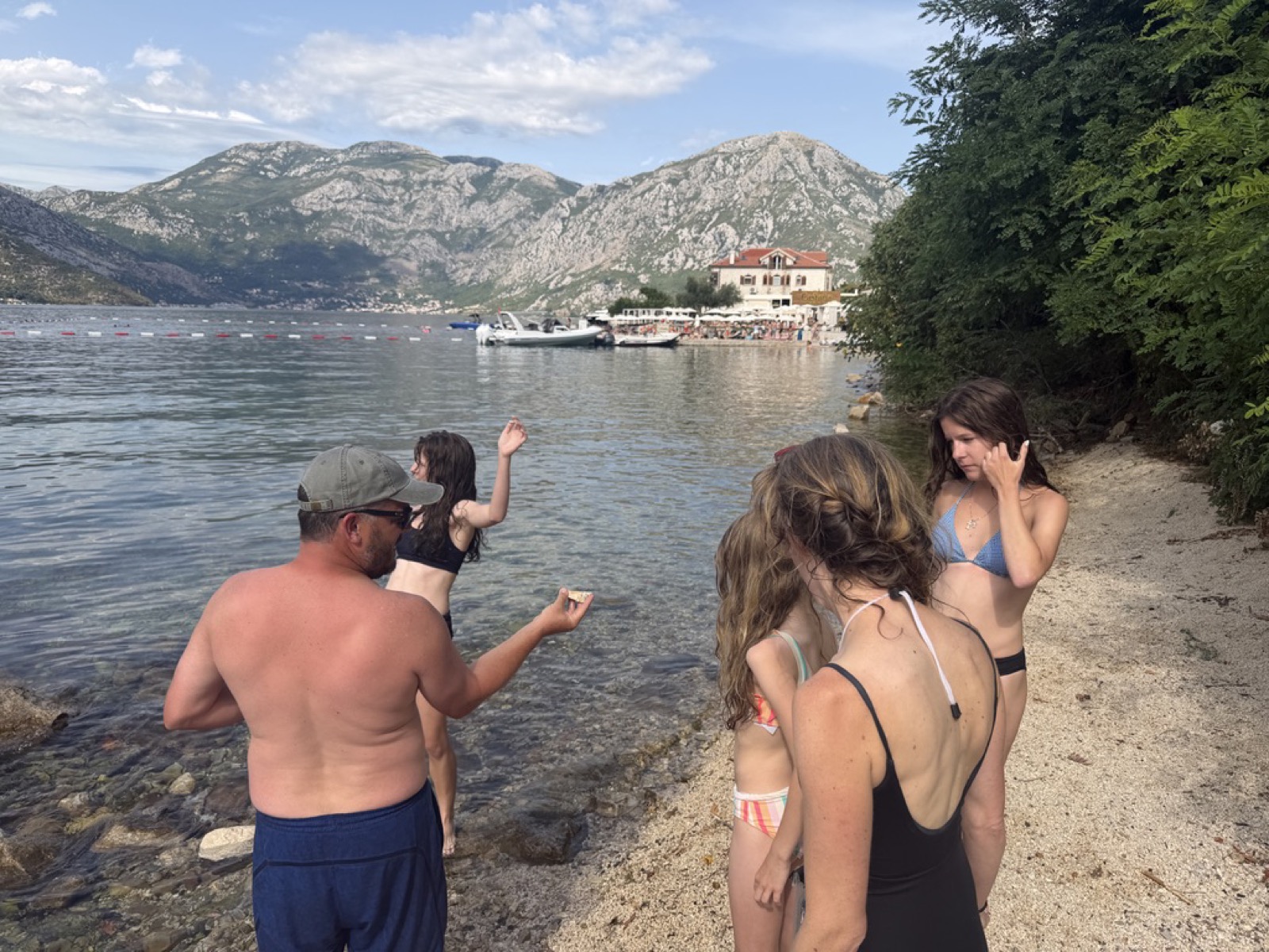 Swimming at the beach club near Morinj Zaliv