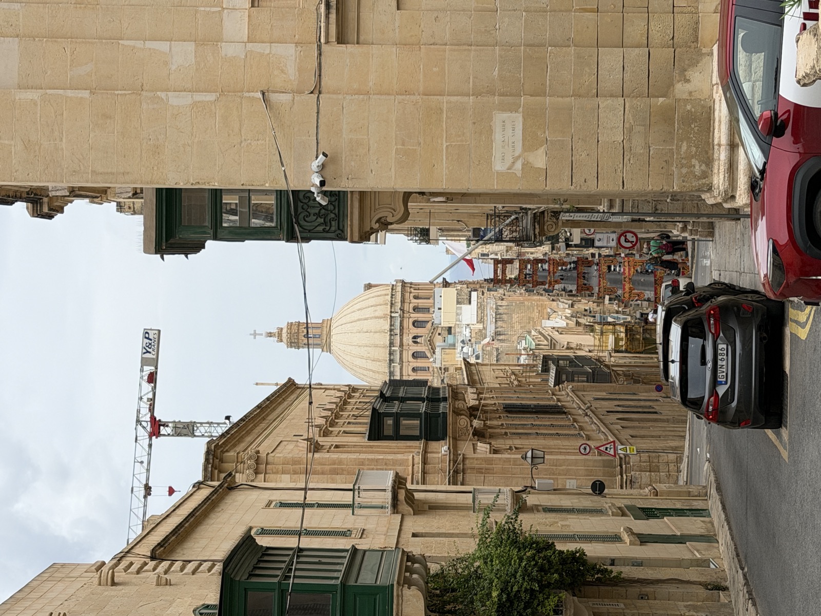 Looking down Cavalier Street in Valletta toward the dome of the Carmelite Church